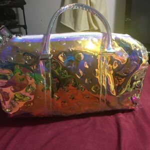 Brand new bag size medium yes fits anything so shiny.